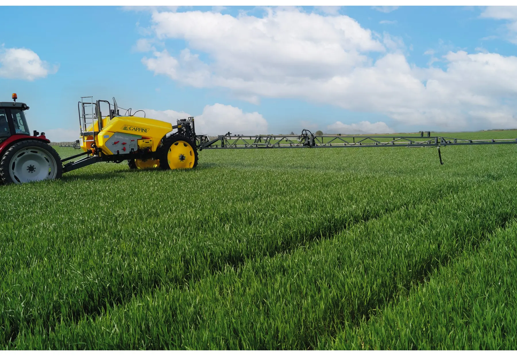 Caffini Global HBM trailed boom sprayer working in a crop